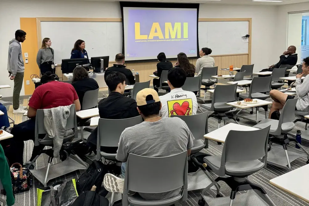 LAMI logo display on screen LAMI event with attendees