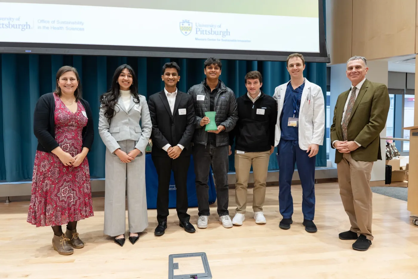 2025 Pitt Sustainability Challenge Award - Team photo with Anne Gohn, Ph.D., Ayesha Akbar Waheed, M.B.B.S., Janam Patel, B.S., Shaunak Patil, Ben Carnovale, B.S., Samuel Wakelin, B.S., John Maier, M.D., Ph.D.